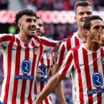 Koke festeggia un gol con i compagni